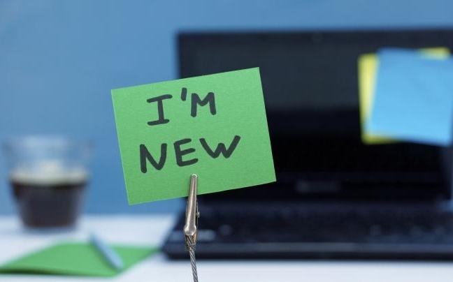 "Im New" sign for new employee